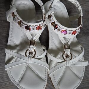 White Sandals with Floral Embellishments